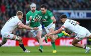 18 March 2023; Hugo Keenan of Ireland is tackled by David Ribbans, left, and Henry Slade of England during the Guinness Six Nations Rugby Championship match between Ireland and England at Aviva Stadium in Dublin. Photo by Ramsey Cardy/Sportsfile