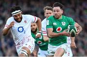 18 March 2023; Hugo Keenan of Ireland makes a break during the Guinness Six Nations Rugby Championship match between Ireland and England at Aviva Stadium in Dublin. Photo by Ramsey Cardy/Sportsfile