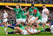 18 March 2023; Ireland players, from left, Jonathan Sexton, Caelan Doris and Josh van der Flier celebrate their side's first try, scored by Dan Sheehan, during the Guinness Six Nations Rugby Championship match between Ireland and England at Aviva Stadium in Dublin. Photo by Ramsey Cardy/Sportsfile