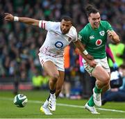 18 March 2023; James Lowe of Ireland in action against Anthony Watson of England during the Guinness Six Nations Rugby Championship match between Ireland and England at Aviva Stadium in Dublin. Photo by Ramsey Cardy/Sportsfile
