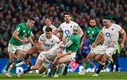 18 March 2023; Mack Hansen of Ireland is tackled by Jack van Poortvliet of England during the Guinness Six Nations Rugby Championship match between Ireland and England at Aviva Stadium in Dublin. Photo by Ramsey Cardy/Sportsfile
