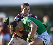 18 March 2023; Jonathan Cassidy of Fermanagh in action against Lorcan Dolan of Westmeath during the Allianz Football League Division 3 match between Fermanagh and Westmeath at St Josephs Park in Ederney, Fermanagh. Photo by Stephen Marken/Sportsfile