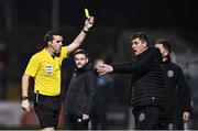 17 March 2023; Bohemians manager Declan Devine is shown a yellow card by referee Robert Harvey during the SSE Airtricity Men's Premier Division match between Bohemians and UCD at Dalymount Park in Dublin. Photo by Sam Barnes/Sportsfile