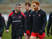 19 March 2023; Derry manager Rory Gallagher, left, in conversation with Conor Glass of Derry before the Allianz Football League Division 2 match between Derry and Clare at Derry GAA Centre of Excellence in Owenbeg, Derry. Photo by Ben McShane/Sportsfile