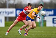 19 March 2023; Manus Doherty of Clare in action against Shane McGuigan of Derry during the Allianz Football League Division 2 match between Derry and Clare at Derry GAA Centre of Excellence in Owenbeg, Derry. Photo by Ben McShane/Sportsfile