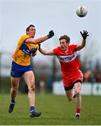 19 March 2023; Cathal O'Connor of Clare in action against Brendan Rogers of Derry during the Allianz Football League Division 2 match between Derry and Clare at Derry GAA Centre of Excellence in Owenbeg, Derry. Photo by Ben McShane/Sportsfile
