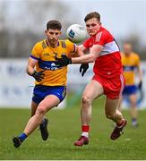 19 March 2023; Ronan Lanigan of Clare in action against Ethan Doherty of Derry during the Allianz Football League Division 2 match between Derry and Clare at Derry GAA Centre of Excellence in Owenbeg, Derry. Photo by Ben McShane/Sportsfile