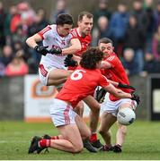 19 March 2023; Chris Óg Jones of Cork in action against Ciaran Murphy, 6, Conor Early, 9, and Niall Sharkey of Louth during the Allianz Football League Division 2 match between Louth and Cork at Páirc Mhuire in Ardee, Louth. Photo by Stephen Marken/Sportsfile