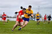 19 March 2023; Niall Toner of Derry in action against Ronan Lanigan of Clare during the Allianz Football League Division 2 match between Derry and Clare at Derry GAA Centre of Excellence in Owenbeg, Derry. Photo by Ben McShane/Sportsfile