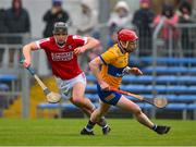 19 March 2023; Padraig Power of Cork goes past Paul Flanagan of Clare on his way to scoring a goal, in the 9th minute,  during the Allianz Hurling League Division 1 Group A match between Clare and Cork at Cusack Park in Ennis, Clare. Photo by Ray McManus/Sportsfile