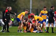 19 March 2023; Clare and Derry players tussle during the Allianz Football League Division 2 match between Derry and Clare at Derry GAA Centre of Excellence in Owenbeg, Derry. Photo by Ben McShane/Sportsfile