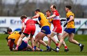 19 March 2023; Clare and Derry players tussle during the Allianz Football League Division 2 match between Derry and Clare at Derry GAA Centre of Excellence in Owenbeg, Derry. Photo by Ben McShane/Sportsfile