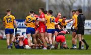 19 March 2023; Clare and Derry players tussle during the Allianz Football League Division 2 match between Derry and Clare at Derry GAA Centre of Excellence in Owenbeg, Derry. Photo by Ben McShane/Sportsfile