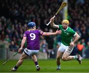 19 March 2023; Richie English of Limerick in action against Kevin Foley of Wexford during the Allianz Hurling League Division 1 Group A match between Limerick and Wexford at TUS Gaelic Grounds in Limerick. Photo by Tyler Miller/Sportsfile