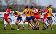 19 March 2023; Clare and Derry players tussle during the Allianz Football League Division 2 match between Derry and Clare at Derry GAA Centre of Excellence in Owenbeg, Derry. Photo by Ben McShane/Sportsfile