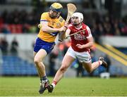 19 March 2023; Seadna Morey of Clare in action against Brian Roche of Cork during the Allianz Hurling League Division 1 Group A match between Clare and Cork at Cusack Park in Ennis, Clare. Photo by John Sheridan/Sportsfile