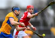 19 March 2023; David McInerney of Clare is tackled by Brian Hayes of Cork during the Allianz Hurling League Division 1 Group A match between Clare and Cork at Cusack Park in Ennis, Clare. Photo by Ray McManus/Sportsfile