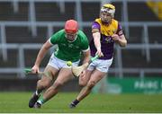 19 March 2023; Colin Coughlan of Limerick in action against Ian Carty of Wexford during the Allianz Hurling League Division 1 Group A match between Limerick and Wexford at TUS Gaelic Grounds in Limerick. Photo by Tyler Miller/Sportsfile