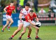 19 March 2023; Niall Sharkey of Louth in action against Colm O’Callaghan of Cork during the Allianz Football League Division 2 match between Louth and Cork at Páirc Mhuire in Ardee, Louth. Photo by Stephen Marken/Sportsfile