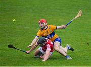 19 March 2023; Padraig Power of Cork is tackled by Darragh Lohan of Clare during the Allianz Hurling League Division 1 Group A match between Clare and Cork at Cusack Park in Ennis, Clare. Photo by Ray McManus/Sportsfile