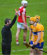 19 March 2023; Referee Thomas Walsh shows a red card to David Fitzgerald of Clare during the Allianz Hurling League Division 1 Group A match between Clare and Cork at Cusack Park in Ennis, Clare. Photo by Ray McManus/Sportsfile