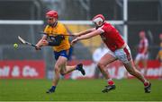 19 March 2023; John Conlon of Clare is tackled by Dáire O’Leary of Cork during the Allianz Hurling League Division 1 Group A match between Clare and Cork at Cusack Park in Ennis, Clare. Photo by Ray McManus/Sportsfile