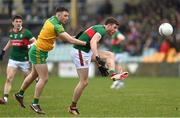 19 March 2023; Fionn McDonagh of Mayo in action against Caolan McColgan of Donegal during the Allianz Football League Division 1 match between Donegal and Mayo at MacCumhaill Park in Ballybofey, Donegal. Photo by Ramsey Cardy/Sportsfile