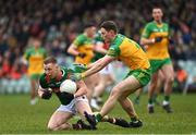 19 March 2023; Ryan O'Donoghue of Mayo in action against Mark Curran of Donegal during the Allianz Football League Division 1 match between Donegal and Mayo at MacCumhaill Park in Ballybofey, Donegal. Photo by Ramsey Cardy/Sportsfile