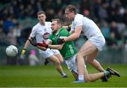 19 March 2023; Sean O'Dea of Limerick is tackled by Darragh Kirwan of Kildare during the Allianz Football League Division 2 match between Limerick and Kildare at TUS Gaelic Grounds in Limerick. Photo by Tyler Miller/Sportsfile