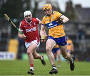 19 March 2023; David Fitzgerald of Clare in action against Eoin Roche of Cork during the Allianz Hurling League Division 1 Group A match between Clare and Cork at Cusack Park in Ennis, Clare. Photo by John Sheridan/Sportsfile