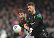 19 March 2023; Donegal goalkeeper Shaun Patton in action against Aidan O'Shea of Mayo during the Allianz Football League Division 1 match between Donegal and Mayo at MacCumhaill Park in Ballybofey, Donegal. Photo by Ramsey Cardy/Sportsfile