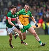 19 March 2023; Fionn McDonagh of Mayo in action against Jason McGee of Donegal during the Allianz Football League Division 1 match between Donegal and Mayo at MacCumhaill Park in Ballybofey, Donegal. Photo by Ramsey Cardy/Sportsfile