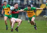 19 March 2023; Matthew Ruane of Mayo in action against Caolan McColgan of Donegal during the Allianz Football League Division 1 match between Donegal and Mayo at MacCumhaill Park in Ballybofey, Donegal. Photo by Ramsey Cardy/Sportsfile
