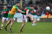 19 March 2023; Fionn McDonagh of Mayo in action against Caolan McColgan of Donegal during the Allianz Football League Division 1 match between Donegal and Mayo at MacCumhaill Park in Ballybofey, Donegal. Photo by Ramsey Cardy/Sportsfile