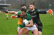 19 March 2023; Aidan O'Shea of Mayo in action against Donegal goalkeeper Shaun Patton, right, and Caolan McGonagle of Donegal during the Allianz Football League Division 1 match between Donegal and Mayo at MacCumhaill Park in Ballybofey, Donegal. Photo by Ramsey Cardy/Sportsfile