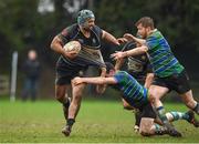 19 March 2023; Joe Manuel of Kilkenny RFC is tackled by John Milne and Fergal Bolger of Gorey RFC during the Bank of Ireland Provincial Towns Cup Third Round match between Gorey RFC and Kilkenny RFC at Gorey RFC in Wexford. Photo by Matt Browne/Sportsfile