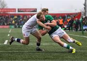 19 March 2023; Hugh Gavin of Ireland scores his side's first try despite Tobias Elliott of England during the U20 Six Nations Rugby Championship match between Ireland and England at Musgrave Park in Cork. Photo by David Fitzgerald/Sportsfile