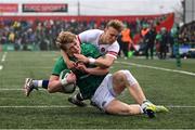 19 March 2023; Hugh Gavin of Ireland scores his side's first try despite Tobias Elliott of England during the U20 Six Nations Rugby Championship match between Ireland and England at Musgrave Park in Cork. Photo by David Fitzgerald/Sportsfile