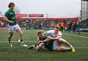 19 March 2023; Hugh Gavin of Ireland scores his side's first try despite Tobias Elliott of England during the U20 Six Nations Rugby Championship match between Ireland and England at Musgrave Park in Cork. Photo by David Fitzgerald/Sportsfile