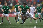 19 March 2023; John Devine of Ireland offloads to team mate Hugh Cooney as he is tackled by Monty Bradbury of England during the U20 Six Nations Rugby Championship match between Ireland and England at Musgrave Park in Cork. Photo by David Fitzgerald/Sportsfile