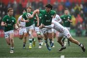 19 March 2023; John Devine of Ireland offloads to team mate Hugh Cooney as he is tackled by Monty Bradbury of England during the U20 Six Nations Rugby Championship match between Ireland and England at Musgrave Park in Cork. Photo by David Fitzgerald/Sportsfile