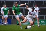 19 March 2023; Jack Sargent of Kildare is tackled by Gordon Brown of Limerick during the Allianz Football League Division 2 match between Limerick and Kildare at TUS Gaelic Grounds in Limerick. Photo by Tyler Miller/Sportsfile