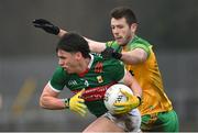 19 March 2023; Sam Callinan of Mayo in action against Eoghan Ban Gallagher of Donegal during the Allianz Football League Division 1 match between Donegal and Mayo at MacCumhaill Park in Ballybofey, Donegal. Photo by Ramsey Cardy/Sportsfile