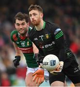 19 March 2023; Donegal goalkeeper Shaun Patton in action against Aidan O'Shea of Mayo during the Allianz Football League Division 1 match between Donegal and Mayo at MacCumhaill Park in Ballybofey, Donegal. Photo by Ramsey Cardy/Sportsfile