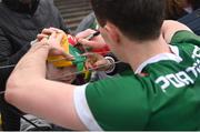 19 March 2023; Diarmuid O'Connor of Mayo signs a hat for Patrick Doocey, age 8, from Belmullet, Mayo, after the Allianz Football League Division 1 match between Donegal and Mayo at MacCumhaill Park in Ballybofey, Donegal. Photo by Ramsey Cardy/Sportsfile