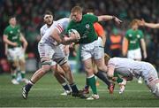 19 March 2023; Paddy McCarthy of Ireland is tackled by Lewis Chessum, right, and Danny Eite of England during the U20 Six Nations Rugby Championship match between Ireland and England at Musgrave Park in Cork. Photo by David Fitzgerald/Sportsfile
