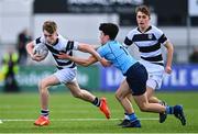 20 March 2023; David Barr of Belvedere College is tackled by Eoin Loo of St Michael's College during the Bank of Ireland Leinster Rugby Schools Junior Cup semi-final replay match between Belvedere College and St Michael’s College at Energia Park in Dublin. Photo by Ben McShane/Sportsfile
