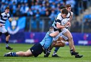 20 March 2023; Ryan Grant of Belvedere College is tackled by Conor Canniffe of St Michael's College during the Bank of Ireland Leinster Rugby Schools Junior Cup semi-final replay match between Belvedere College and St Michael’s College at Energia Park in Dublin. Photo by Ben McShane/Sportsfile