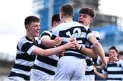 20 March 2023; Paul Dunne of Belvedere College, 12, celebrates with teammates after scoring their side's second try during the Bank of Ireland Leinster Rugby Schools Junior Cup semi-final replay match between Belvedere College and St Michael’s College at Energia Park in Dublin. Photo by Ben McShane/Sportsfile