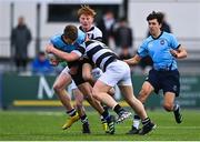 20 March 2023; Josh Divilly of St Michael's College is tackled by Jonny Garrihy, left, and Billy Ball of Belvedere College during the Bank of Ireland Leinster Rugby Schools Junior Cup semi-final replay match between Belvedere College and St Michael’s College at Energia Park in Dublin. Photo by Ben McShane/Sportsfile